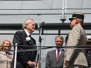 Burlington's William B. McConnell, left, was presented with the Legion of Honour distinction by Colonel Roger Vandomme, representing the French Consul General, during a special ceremony aboard the HMS Haida in Hamilton Sunday. In the background, Karen McCrimmon, representing Veterans Affairs and Mayor Rick Goldring.